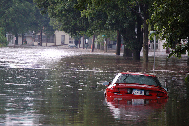 Flooded street and car